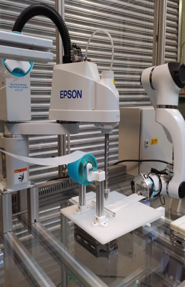 a 6-axis collaborative robot interfaced to a SCARA robot